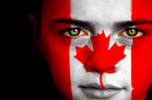 Portrait of a boy with the flag of Canada painted on his face