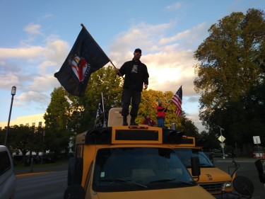 Man at anti-immigration rally stands against ANTIFA